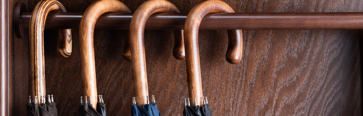 Classic wooden handle umbrellas hanging up