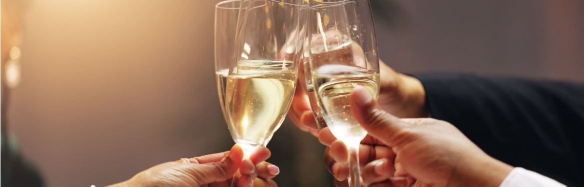 A group of people clinking champagne glasses.