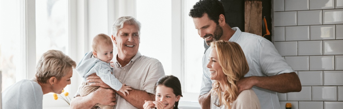 Three generations of family cooking in the kitchen