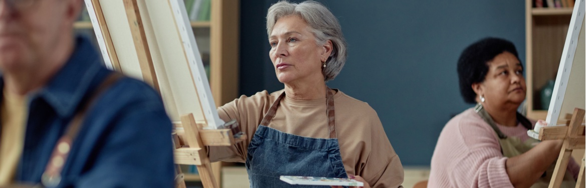 A group painting on easels in an art studio.