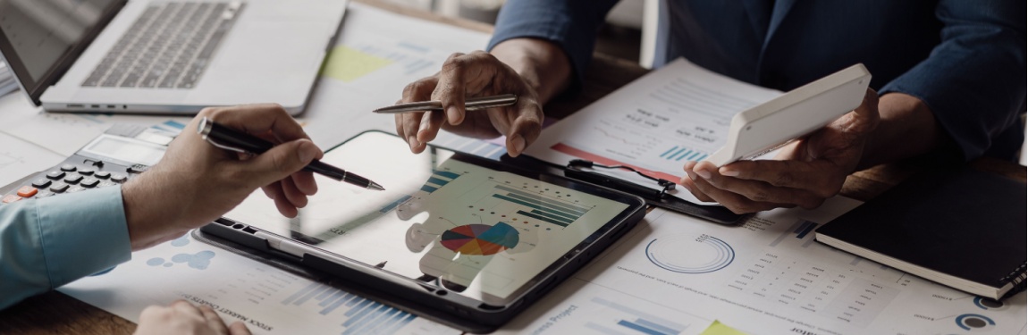 Business people looking at documents in an office.
