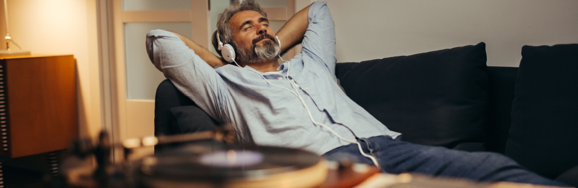 A man relaxing while listening to music.
