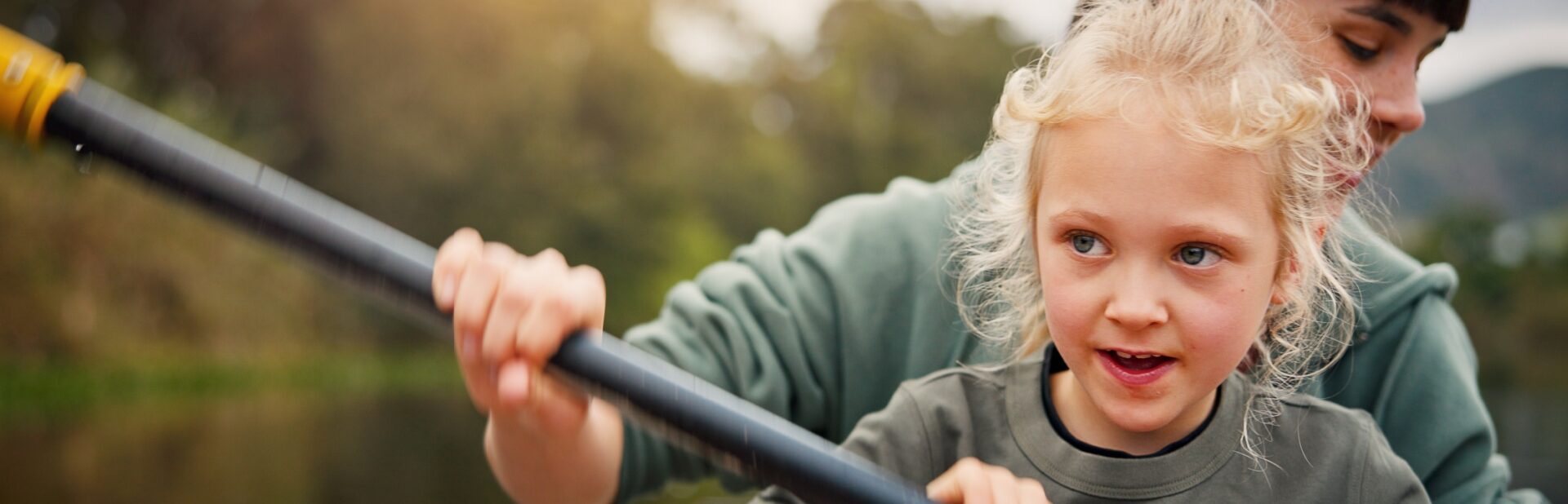 A mum and child kayaking.